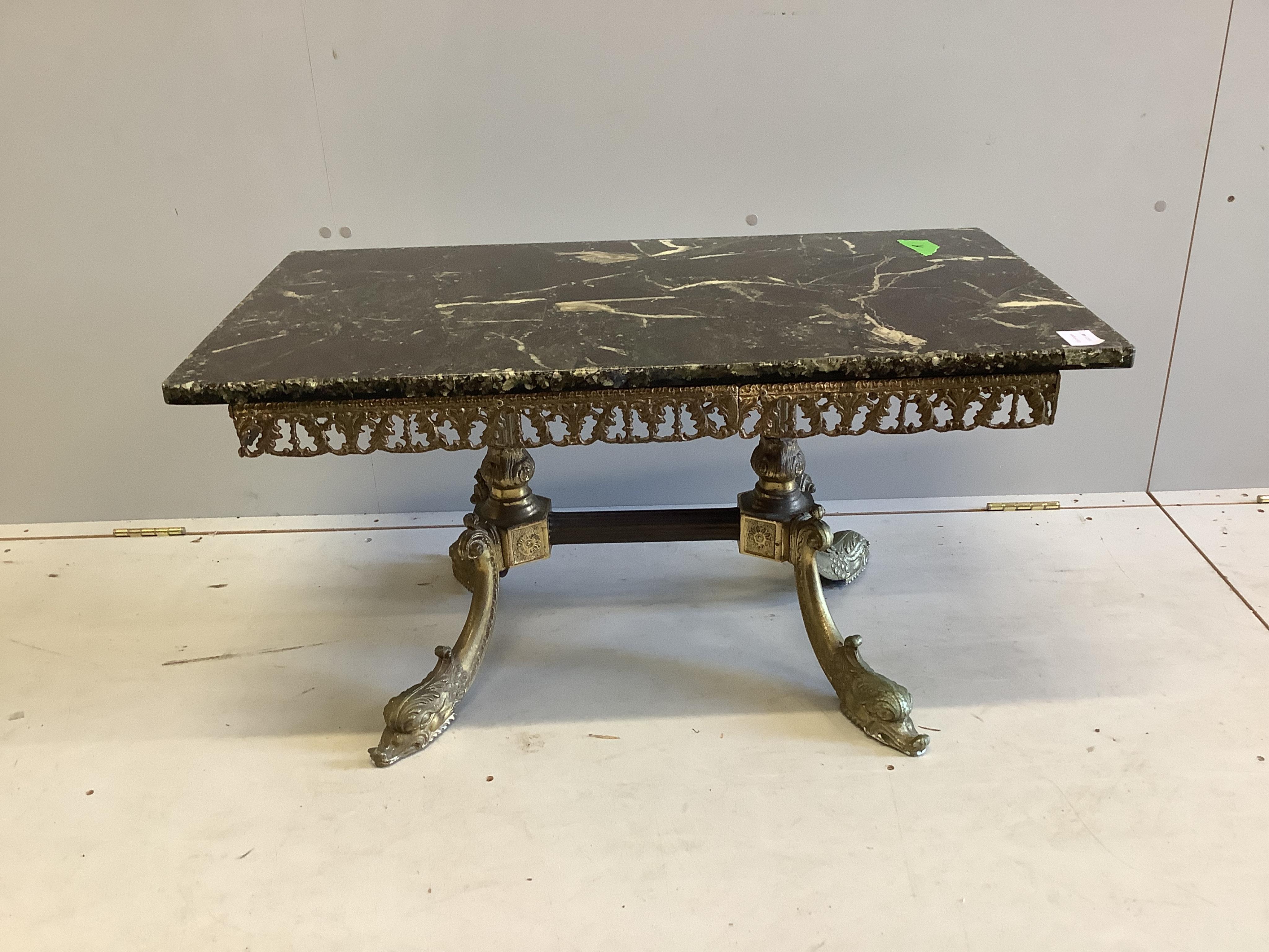 A rectangular faux marble and gilt metal rectangular coffee table on scroll dolphin feet, width 89cm, depth 50cm, height 46cm. Condition - good